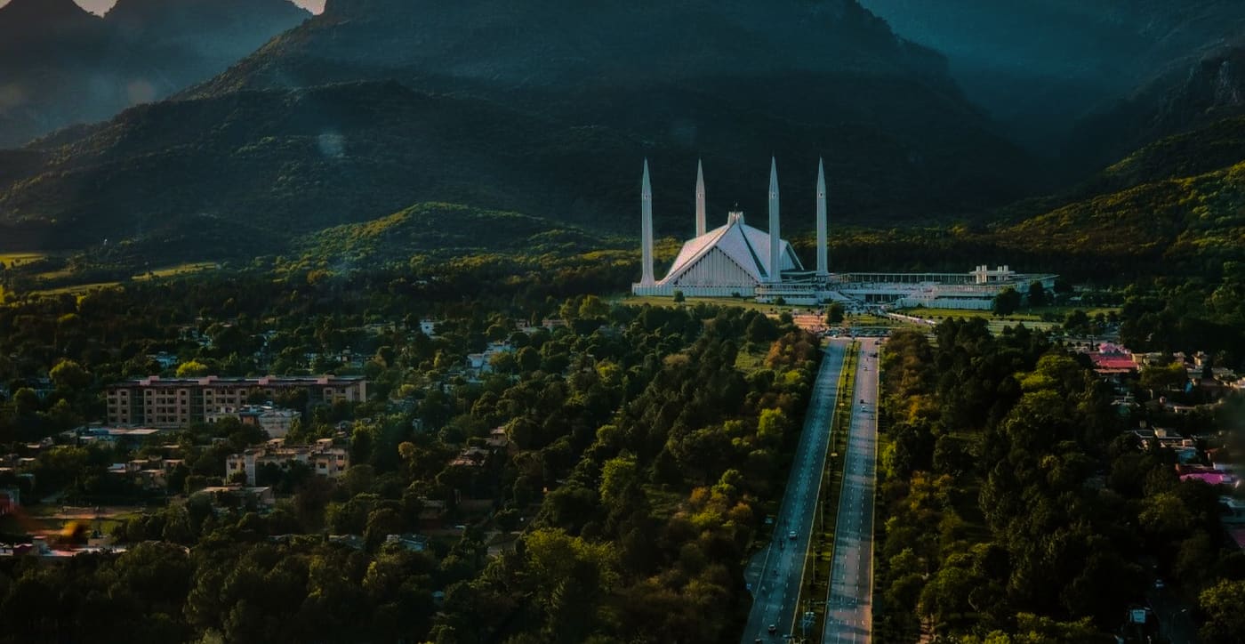 Faisal Mosque and the Margalla Hills above the tree-lined avenues of Islamabad