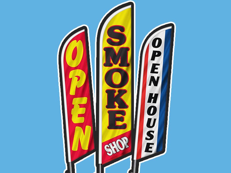 Three stock feather flags reading Open, Smoke Shop and Open House against a blue background