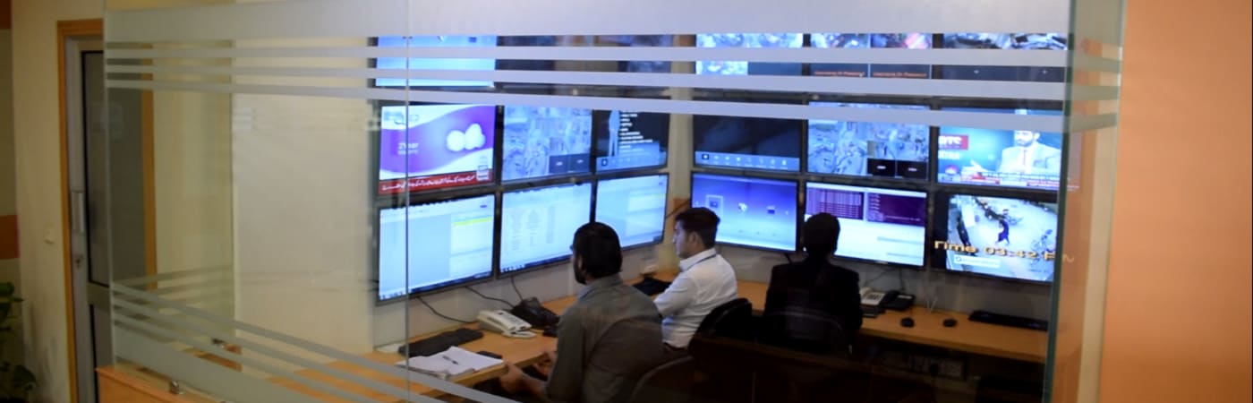 SSS monitoring control room with analysts at workstations